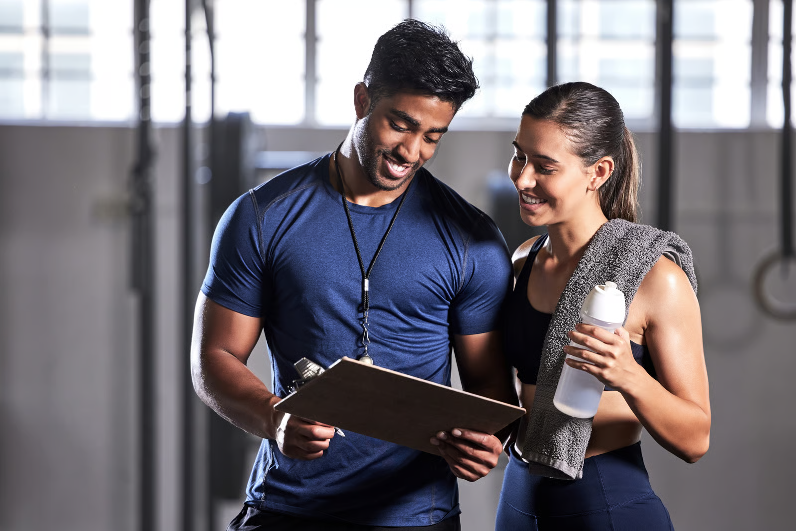 Onyx Elevate coach training with dumbbells